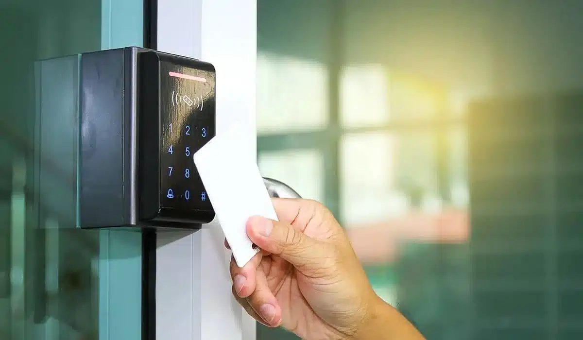 Office worker using keycard entry Office worker using keycard entry